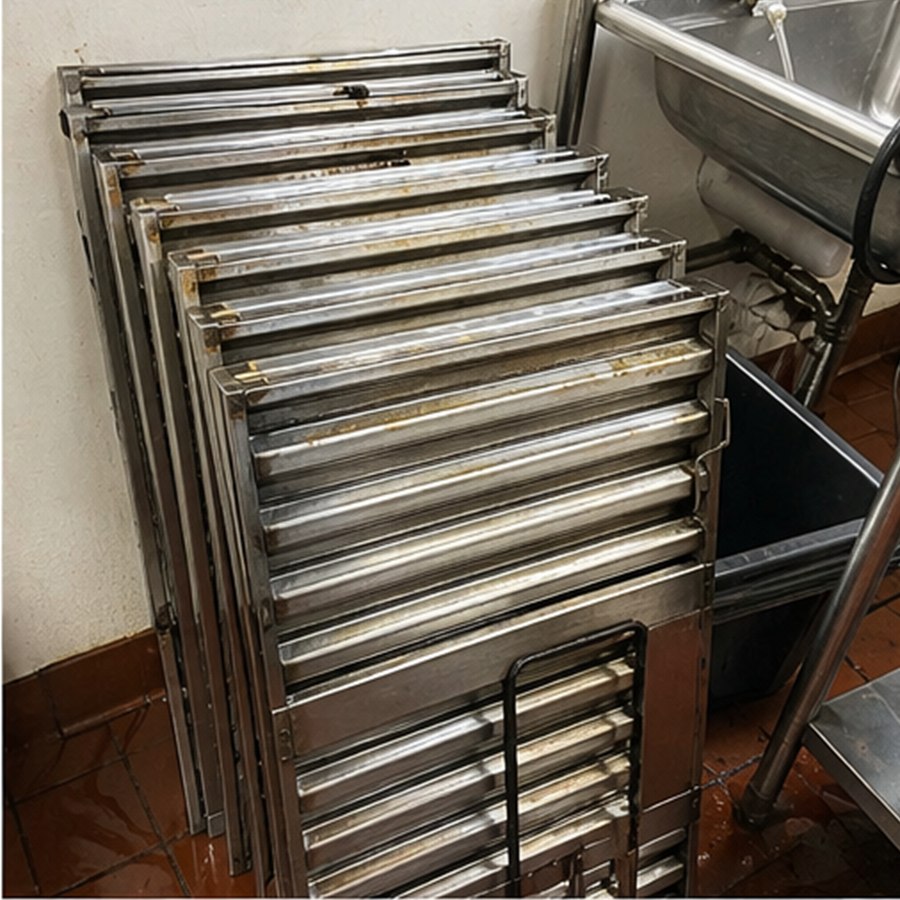 Clean baffle filters after kitchen exhaust service